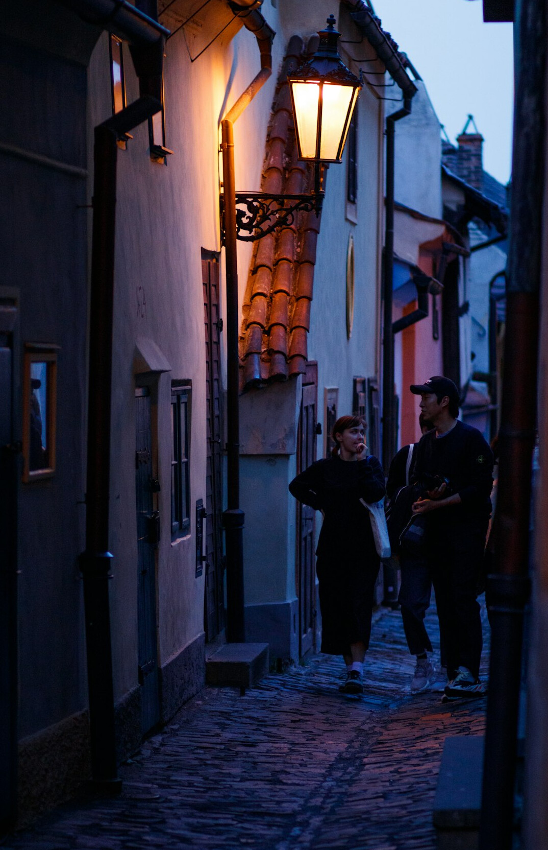 Narrow street in a small Polish town at dusk
